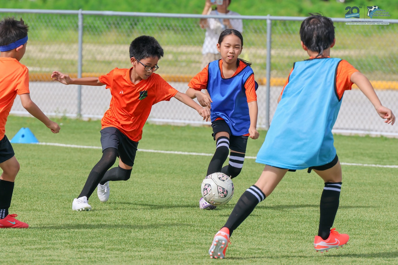 May be an image of 4 people, people playing football and people playing soccer