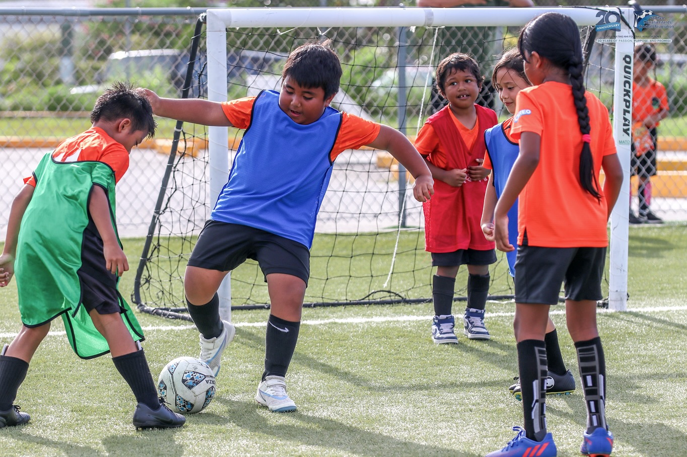 May be an image of 5 people, people playing soccer and people playing football