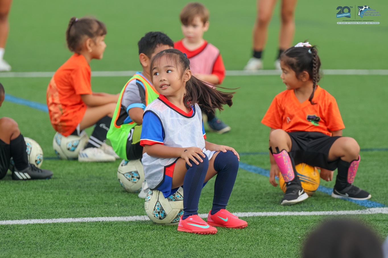 May be an image of 7 people, child, people playing football, people playing soccer and text