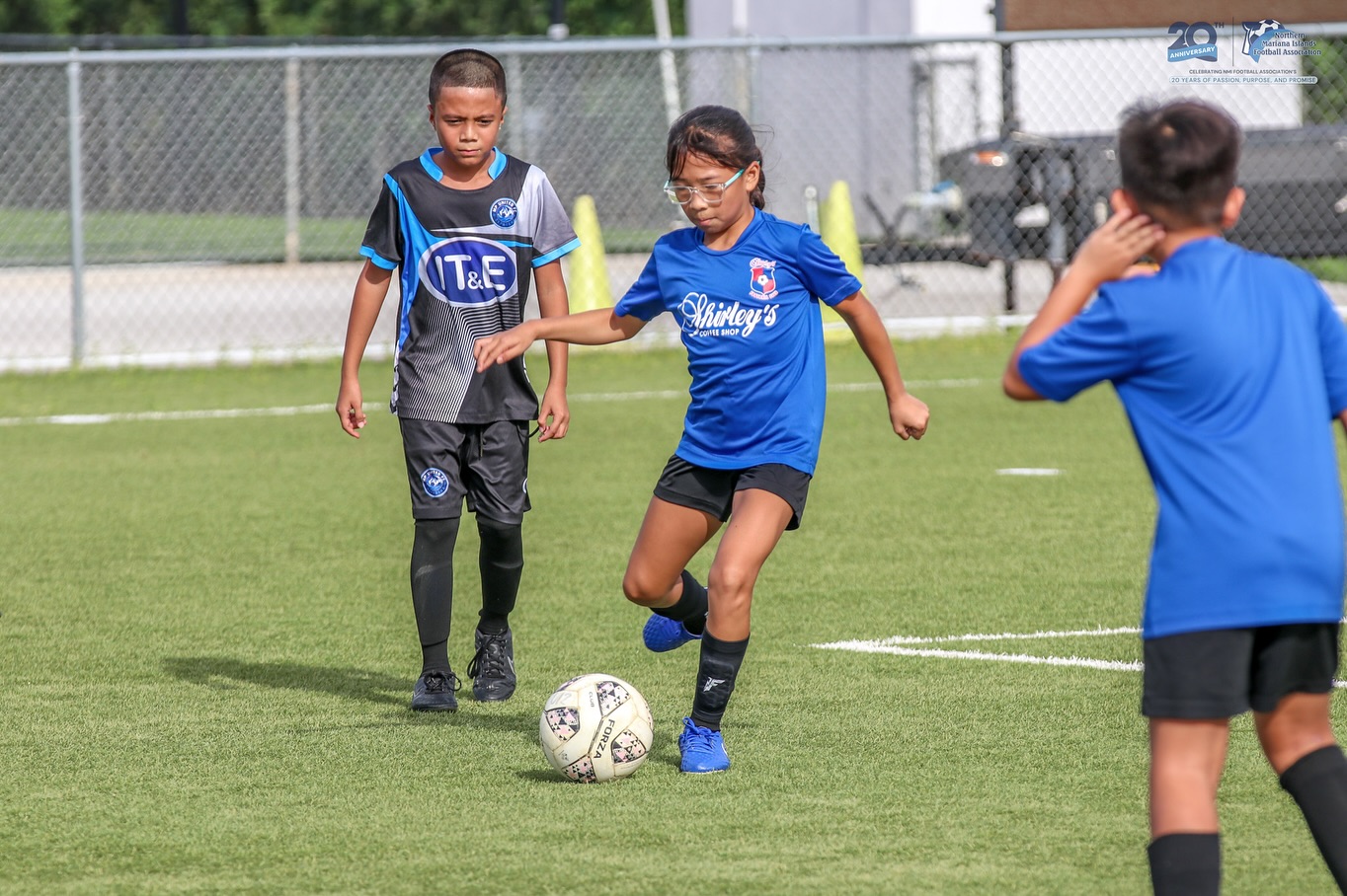 May be an image of 3 people, people playing football, people playing soccer and text