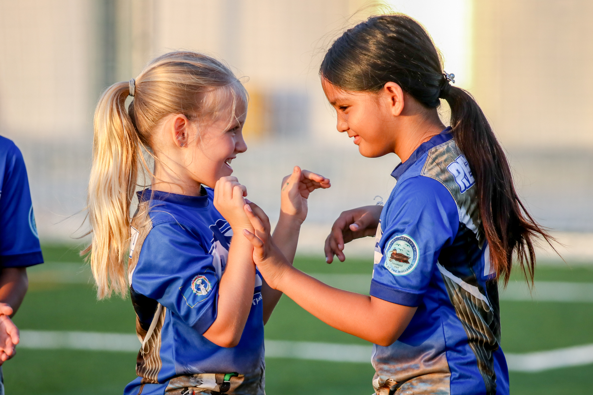 May be an image of 3 people, people playing soccer and people playing football