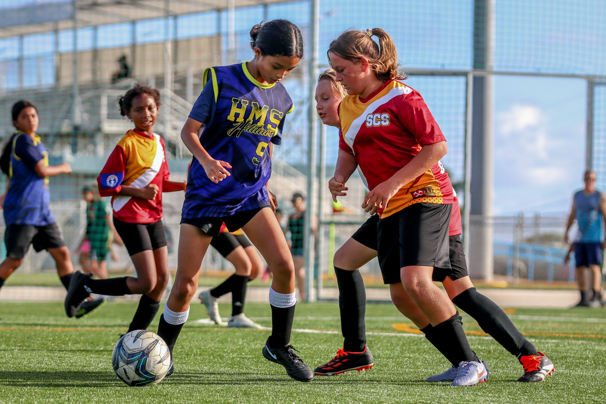May be an image of 5 people, people playing soccer, people playing football and text