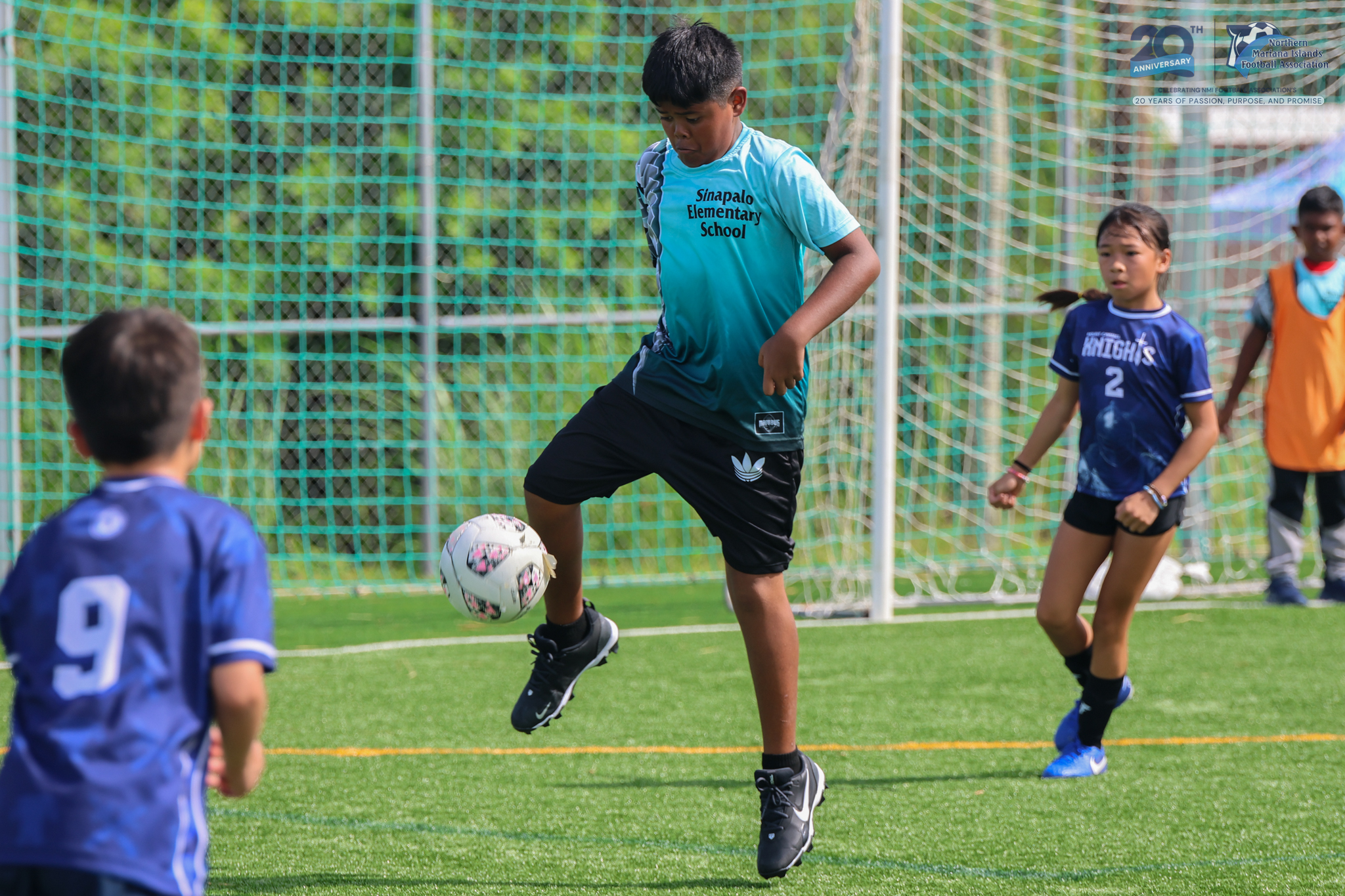 May be an image of 4 people, people playing soccer, people playing football and text