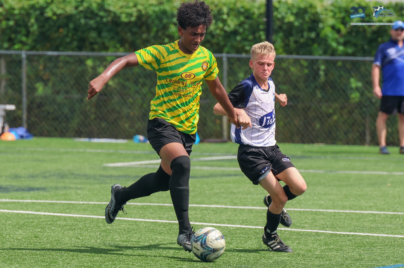 May be an image of 3 people, people playing football, people playing soccer and text