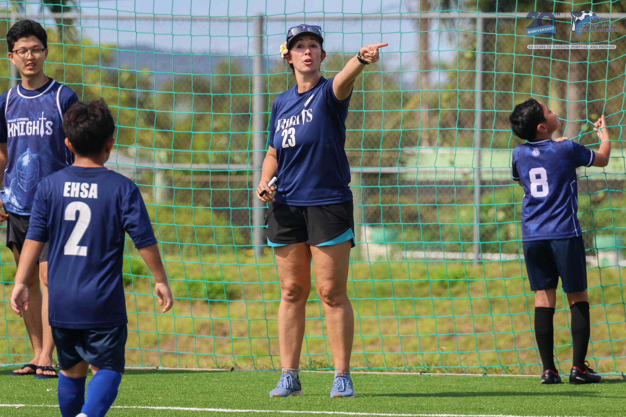 May be an image of 4 people, people playing soccer, people playing football and text