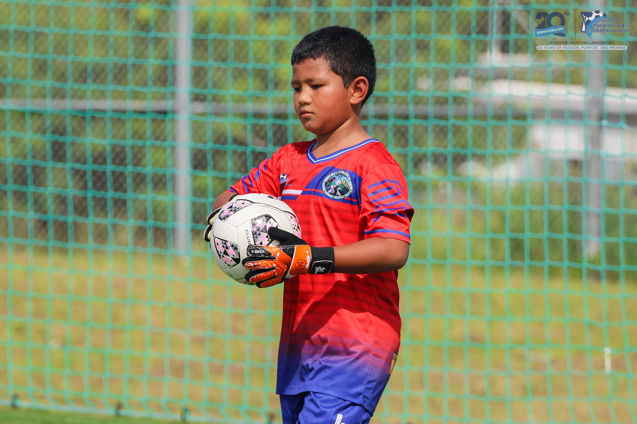 May be an image of 1 person, playing soccer, playing football and text