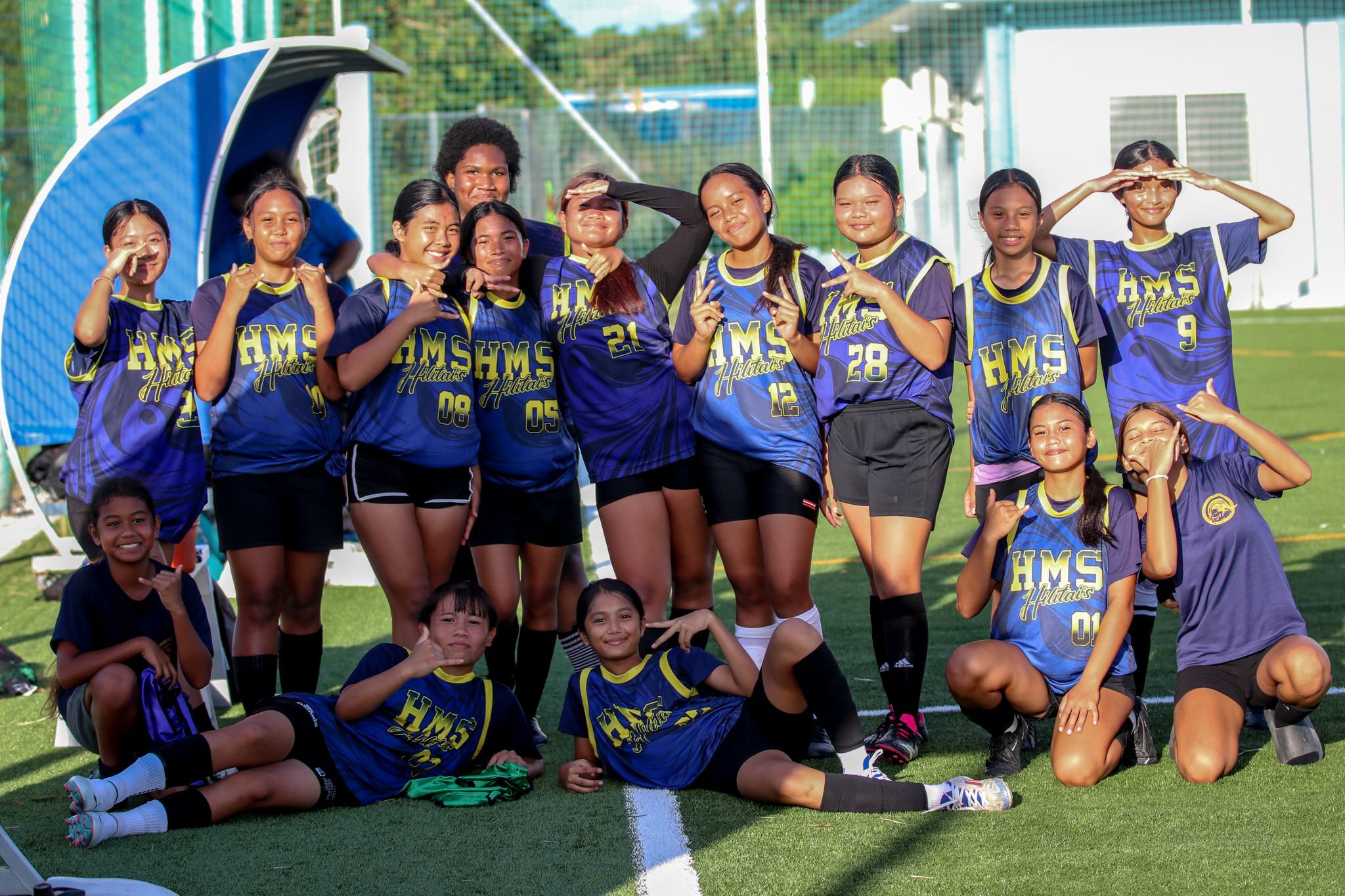 May be an image of 11 people, people playing soccer and text