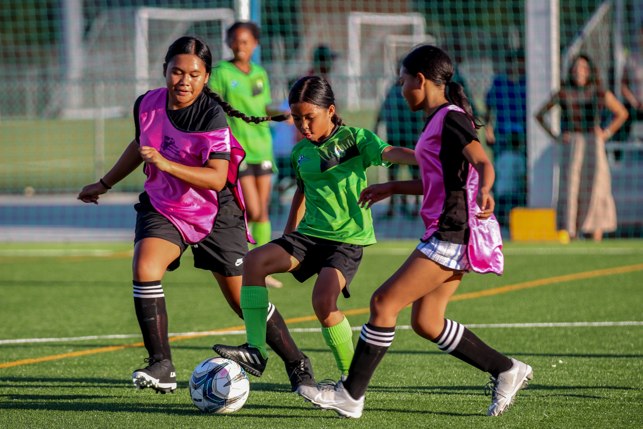 May be an image of 4 people, people playing soccer, people playing football and grass