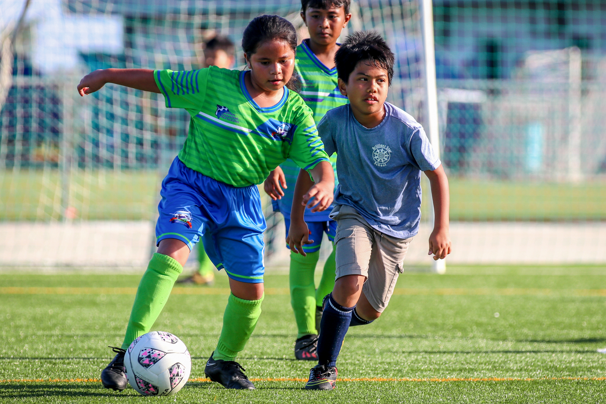 May be an image of 2 people, people playing soccer and people playing football