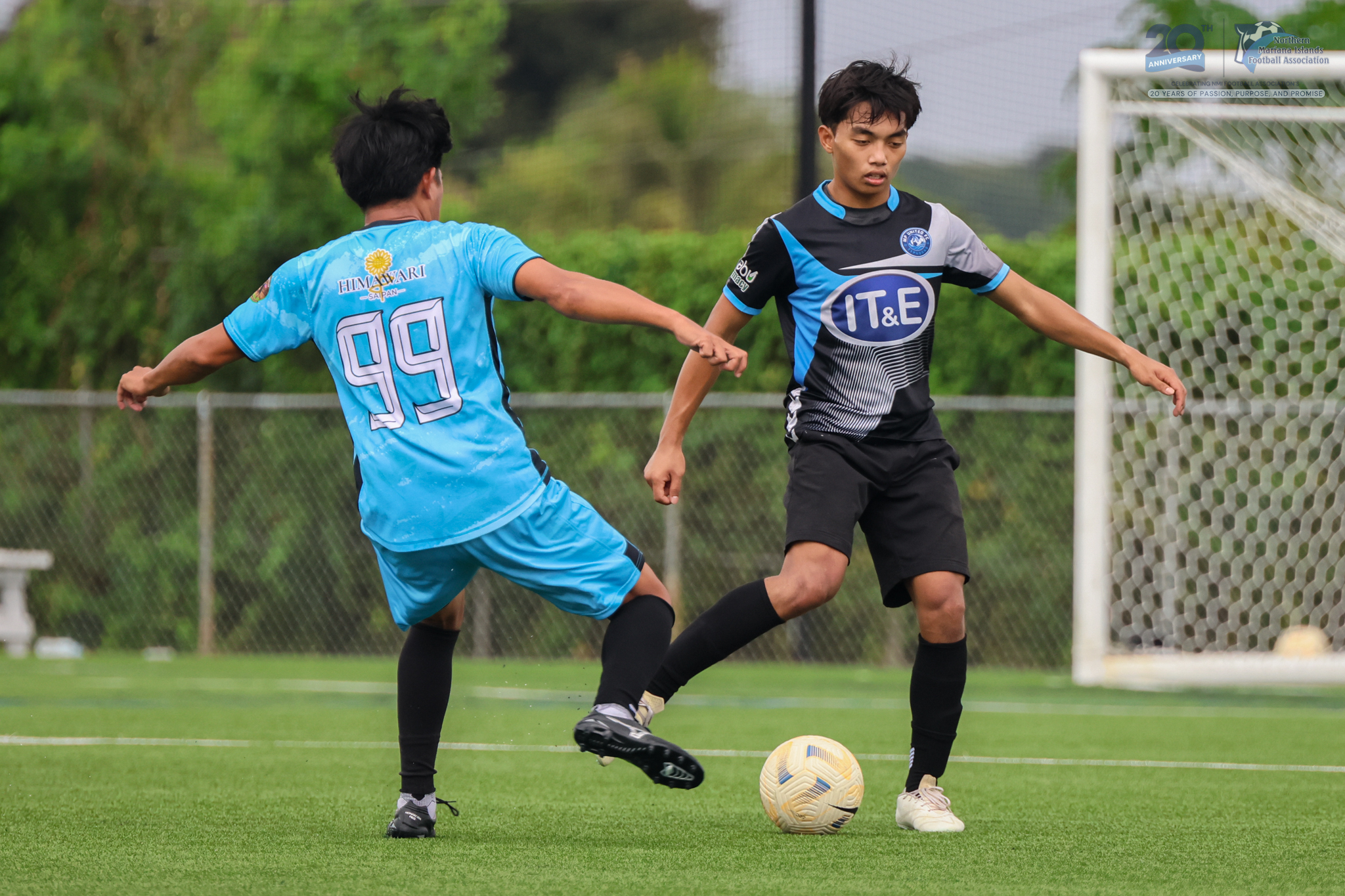 May be an image of 2 people, people playing football, people playing soccer and text