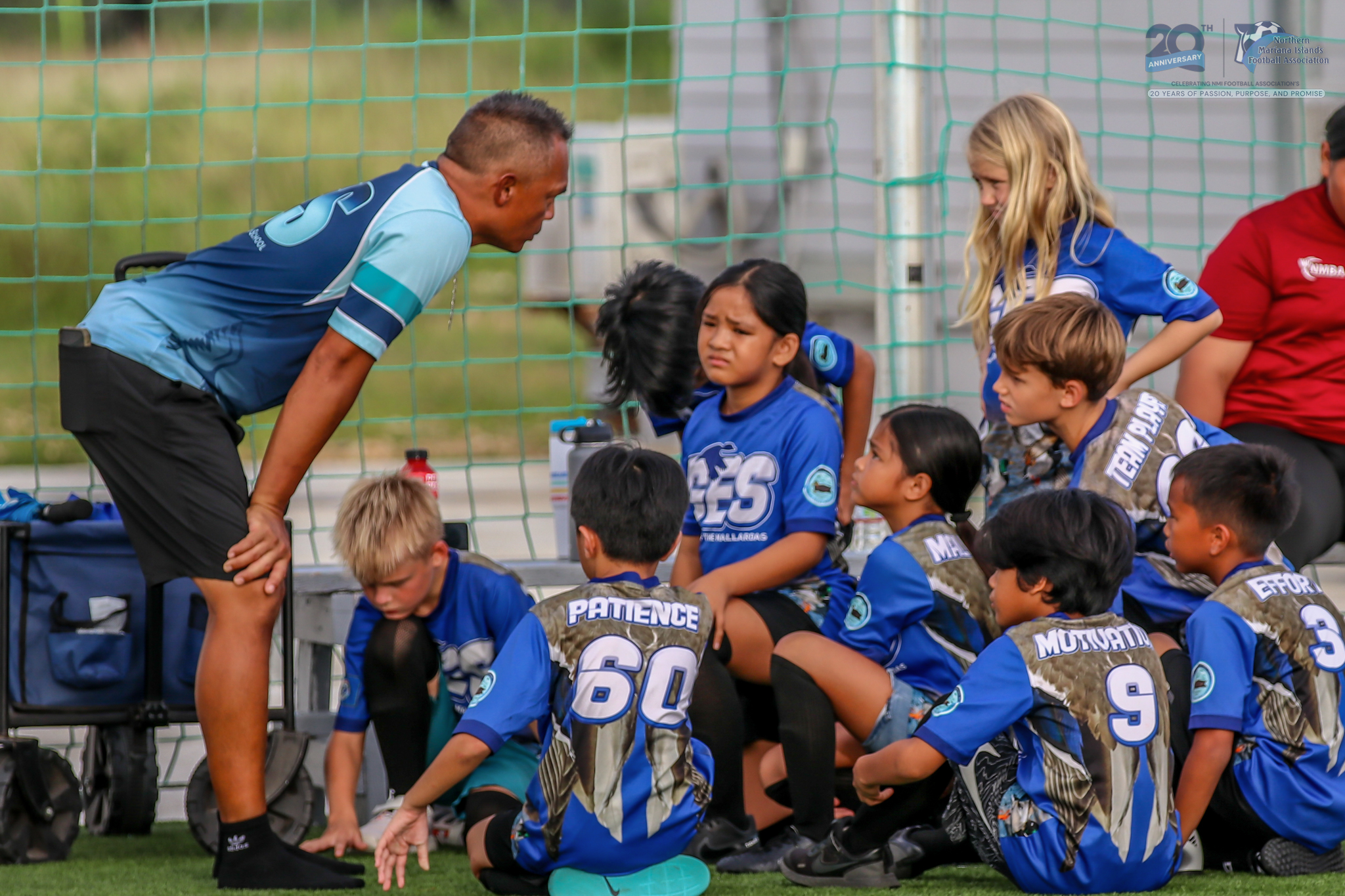 May be an image of 8 people, people playing football, people playing soccer and text