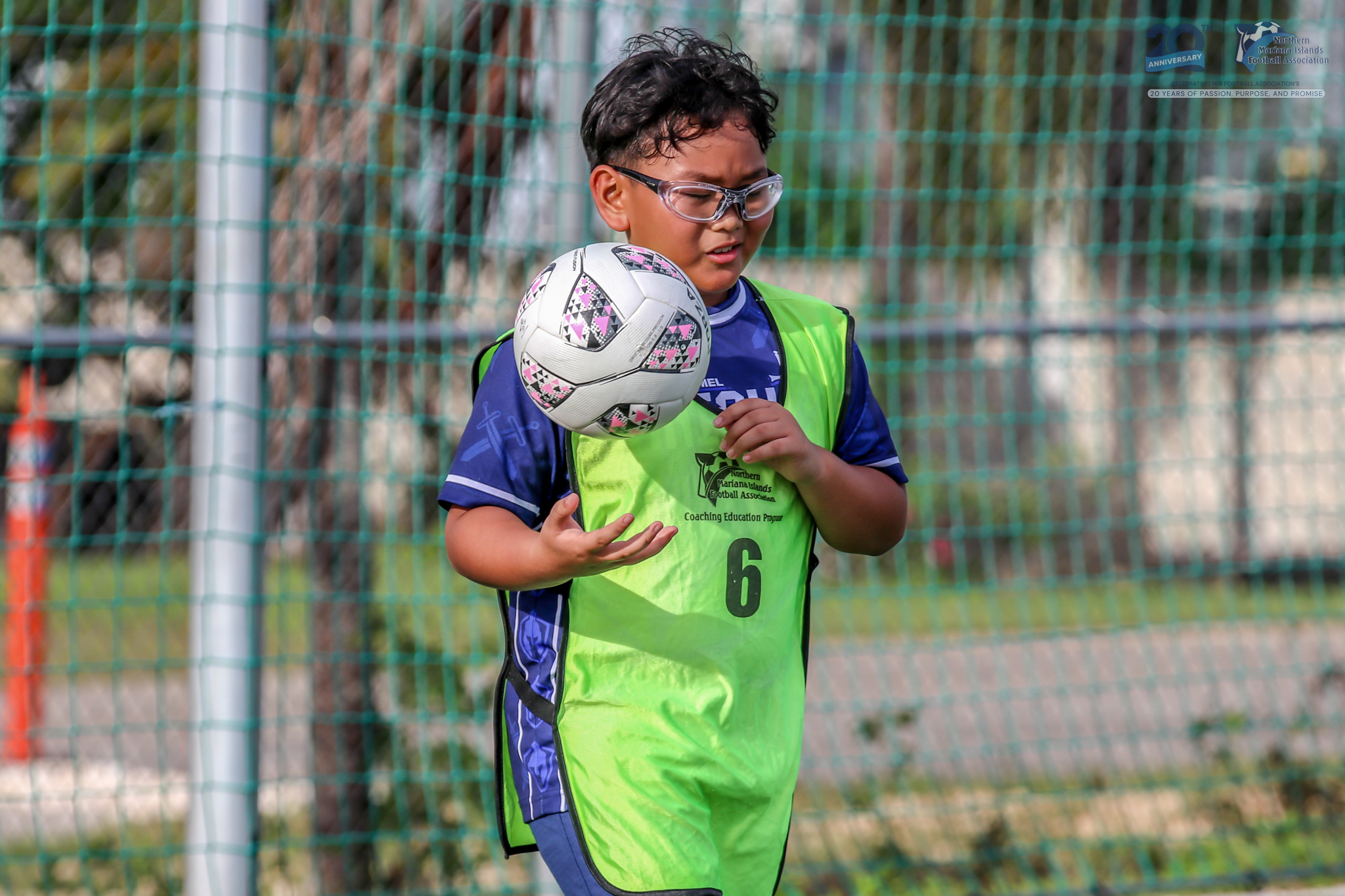 May be an image of 1 person, playing football, playing soccer and text