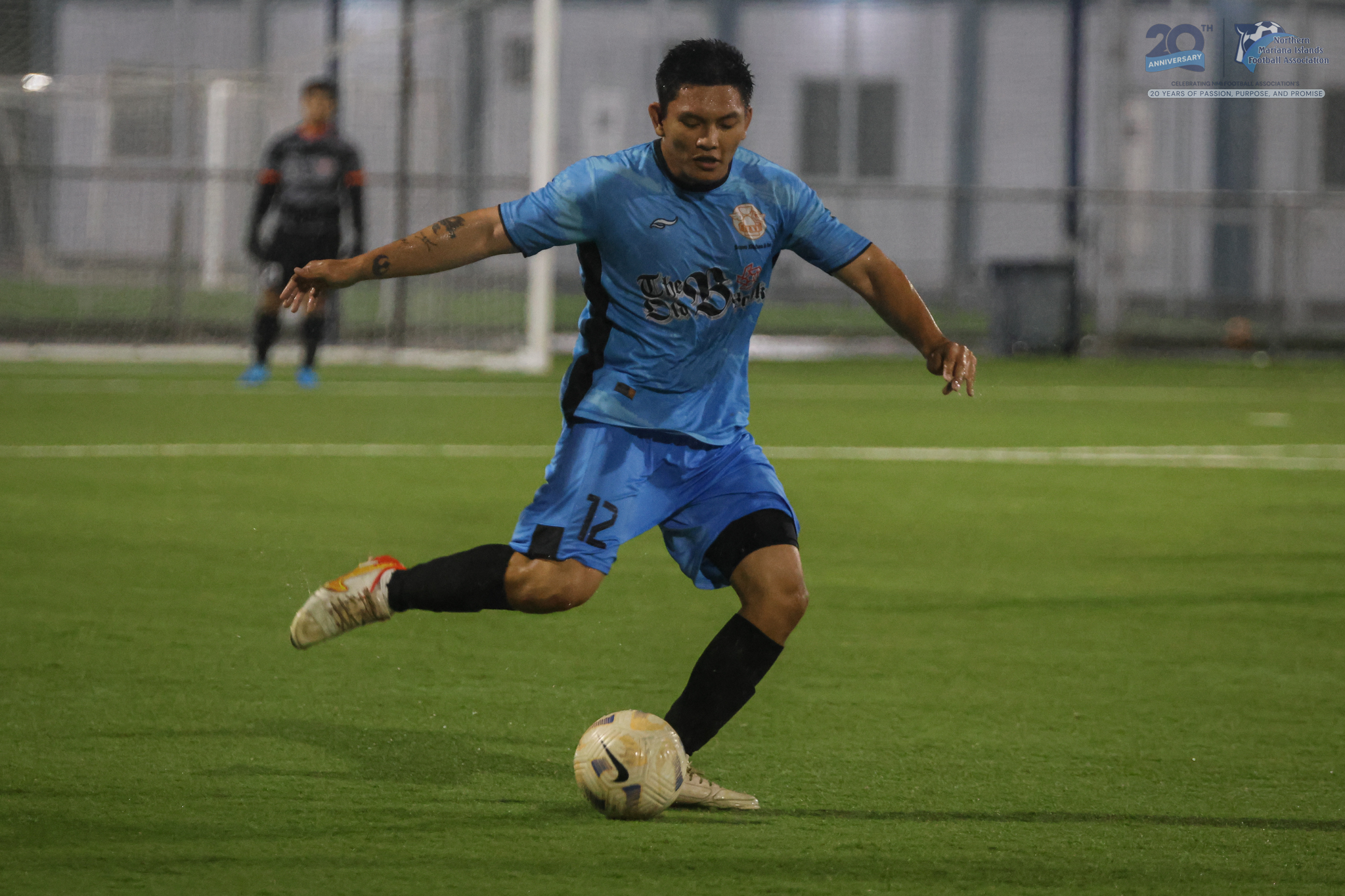 May be an image of 2 people, people playing football, people playing soccer and text