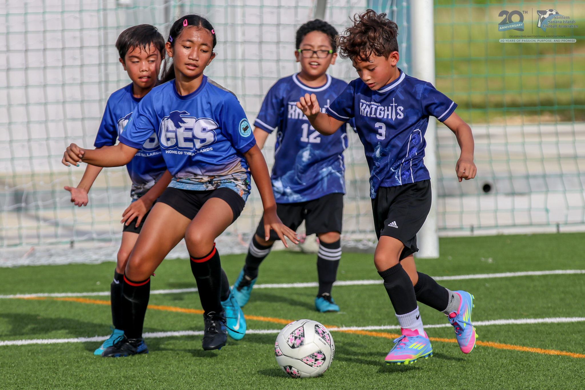 May be an image of 3 people, people playing football, people playing soccer and text