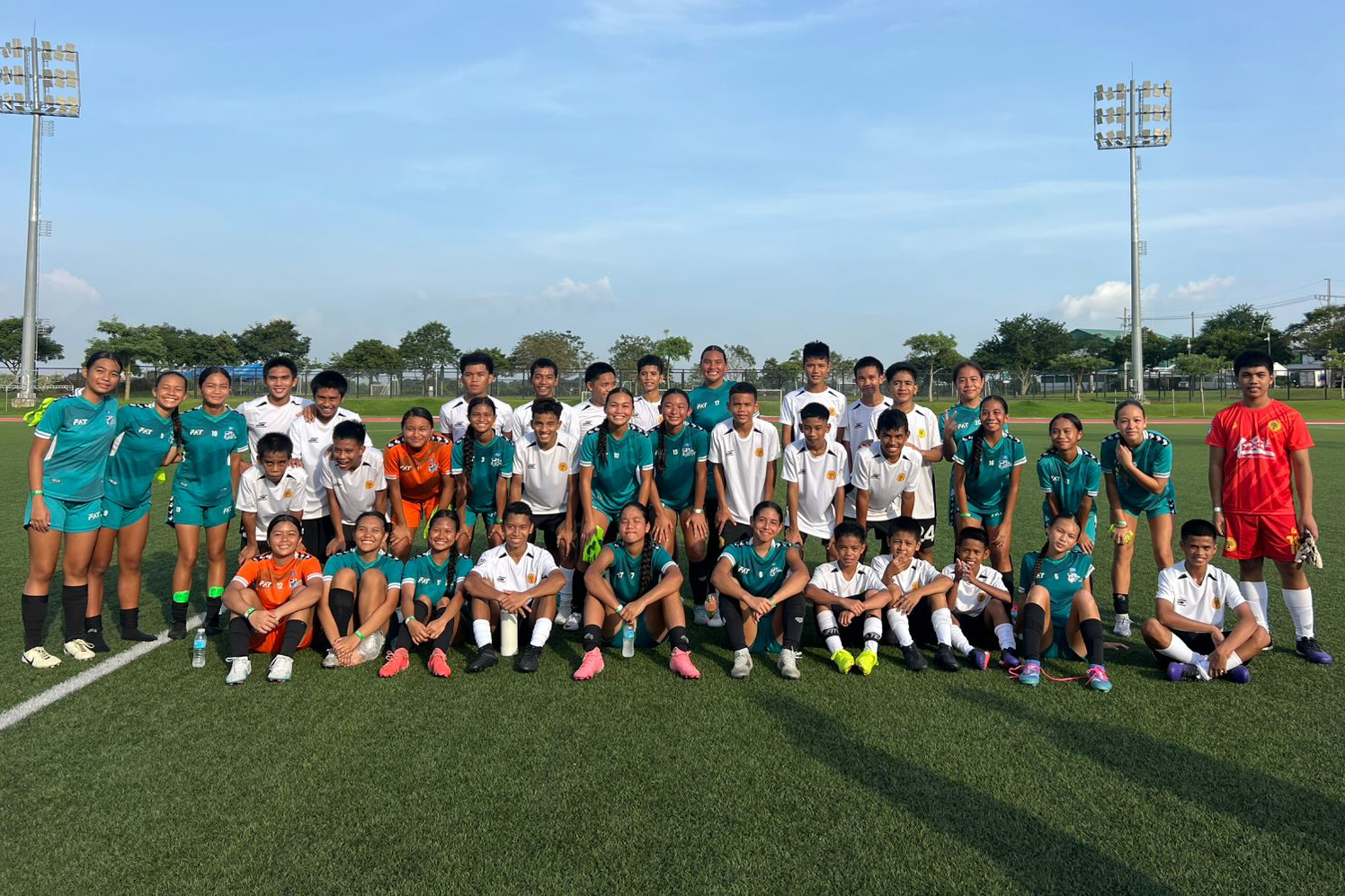 May be an image of 5 people, people playing football, people playing soccer and text