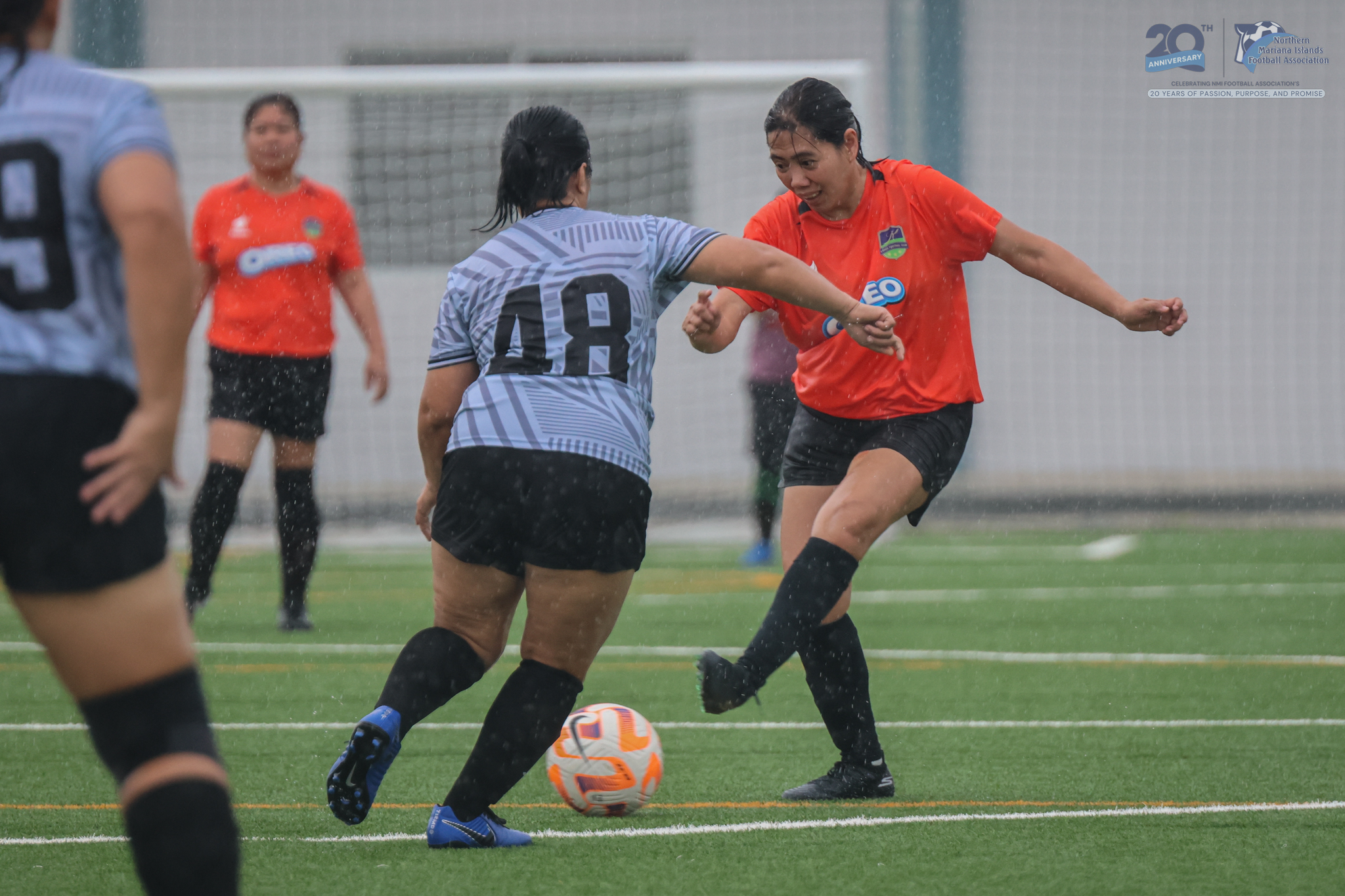 May be an image of 4 people, people playing football, people playing soccer and text