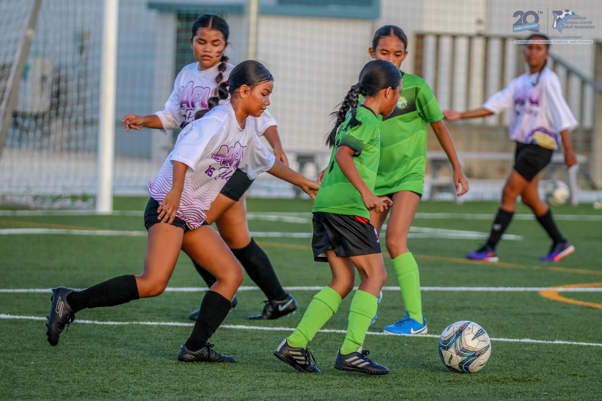 May be an image of 3 people, people playing football, people playing soccer and text