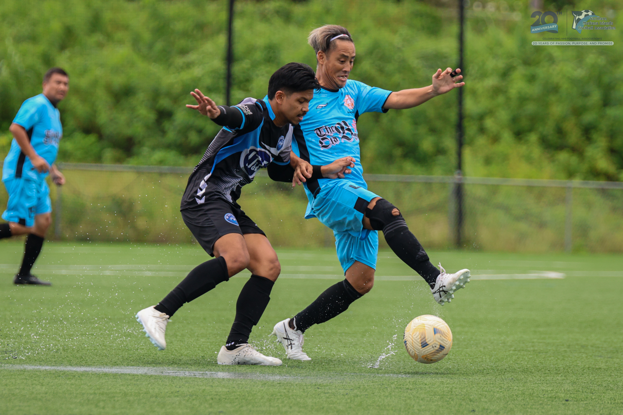 May be an image of 3 people, people playing football, people playing soccer and text