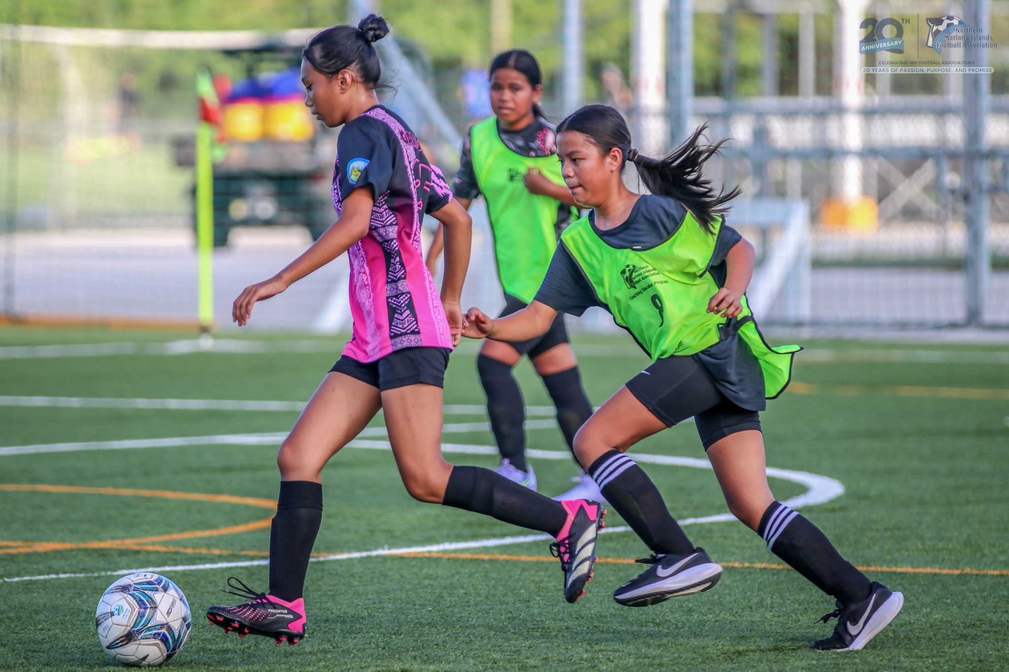 May be an image of 2 people, people playing football, people playing soccer and text