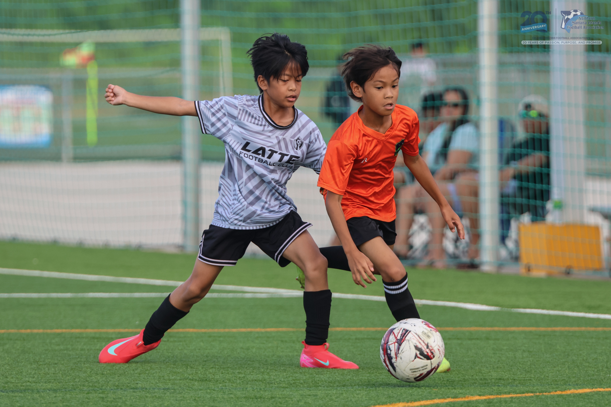 May be an image of 3 people, people playing soccer, people playing football and text