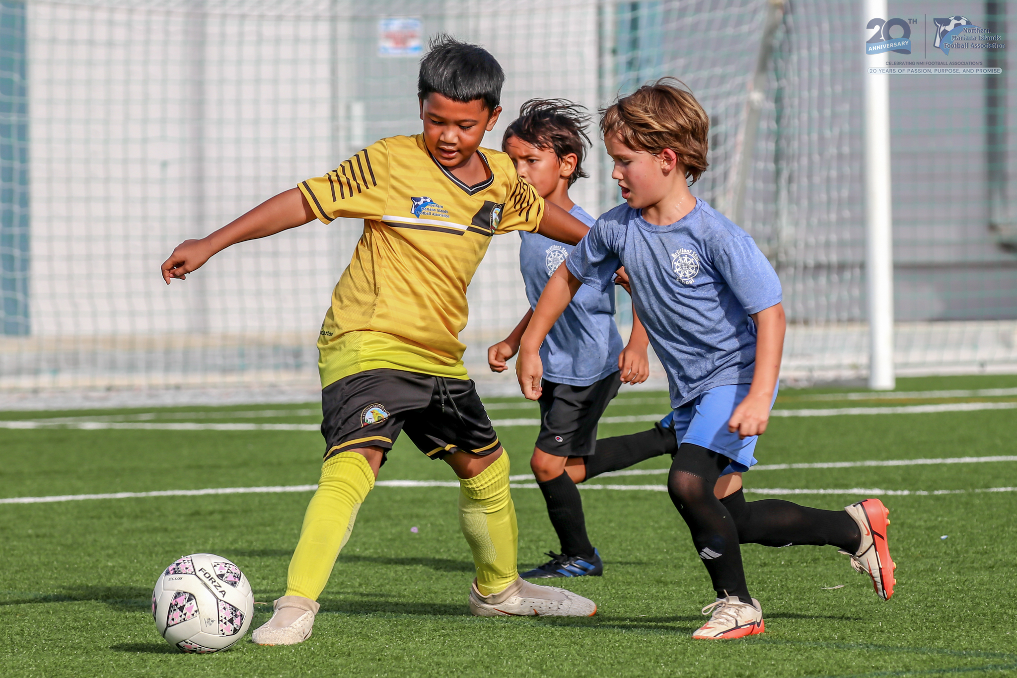 May be an image of 2 people, people playing football, people playing soccer and text