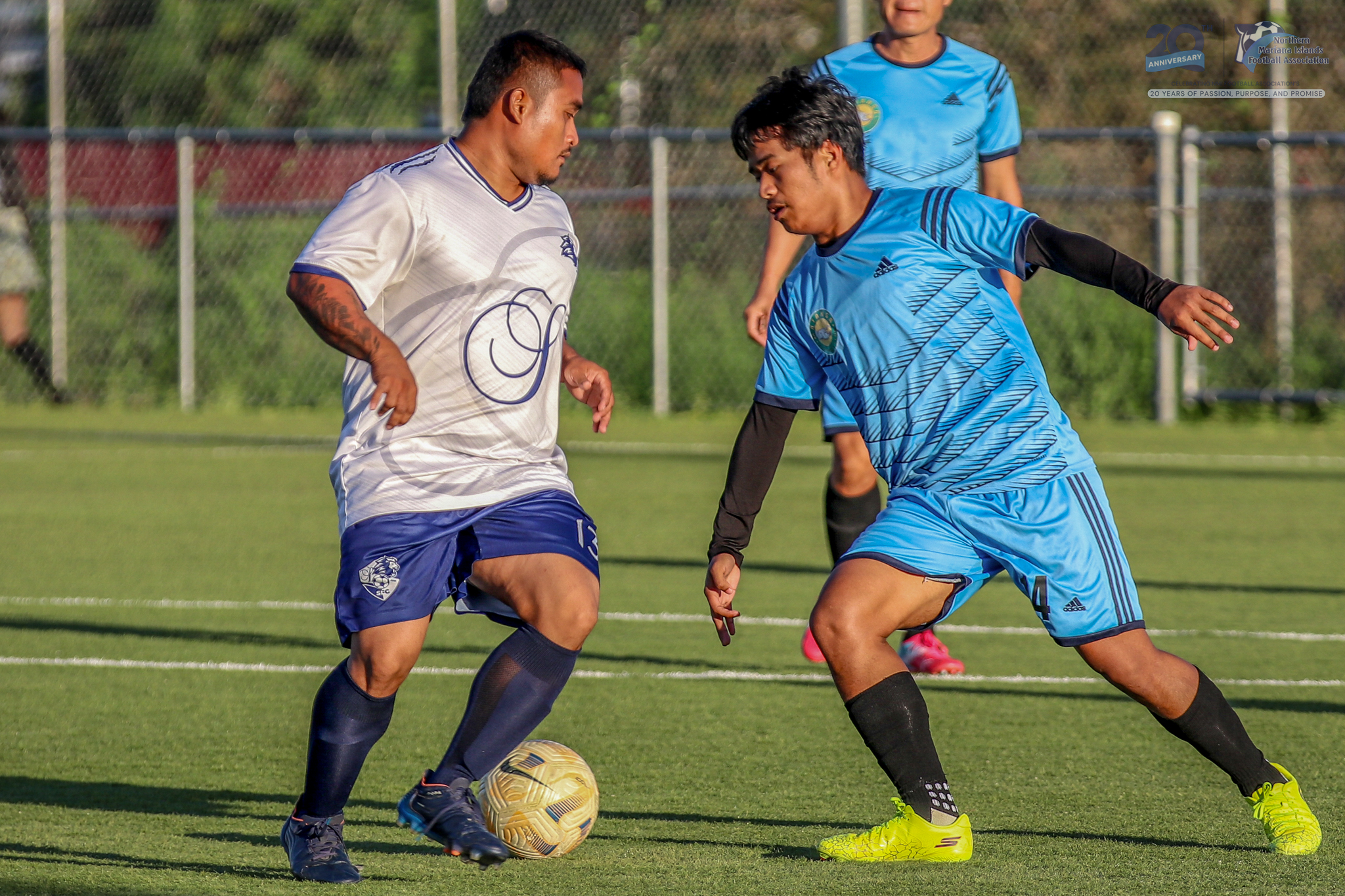 May be an image of 2 people, people playing soccer, people playing football and text