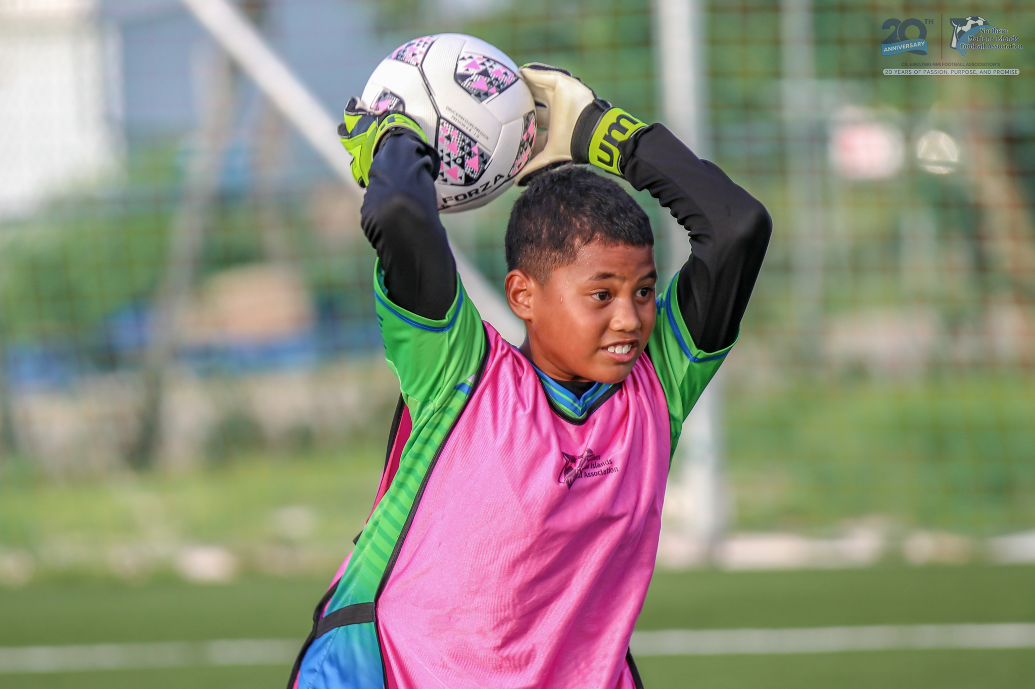 May be an image of 1 person, playing soccer, playing football and text