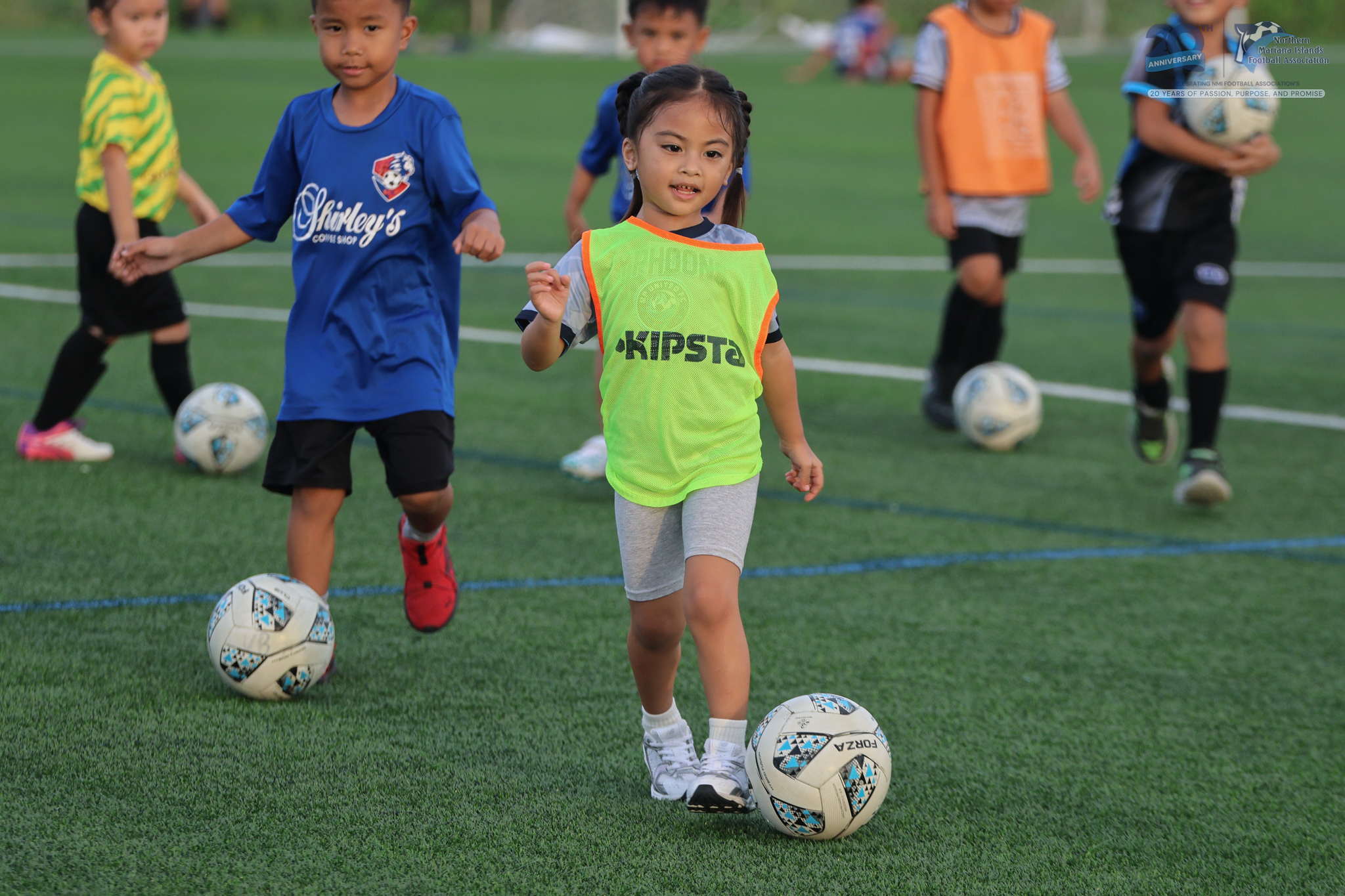 May be an image of 6 people, child, people playing soccer, people playing football and text