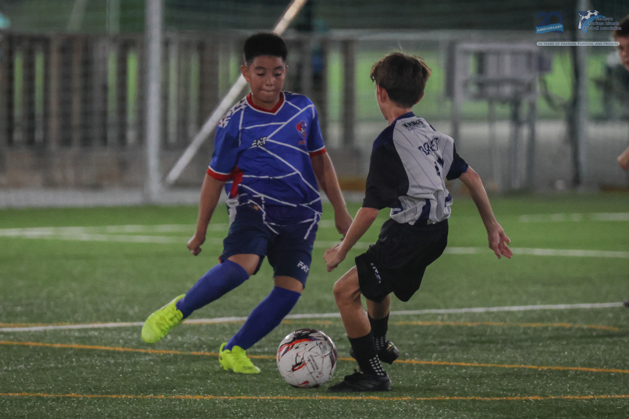 May be an image of 2 people, people playing football, people playing soccer and text