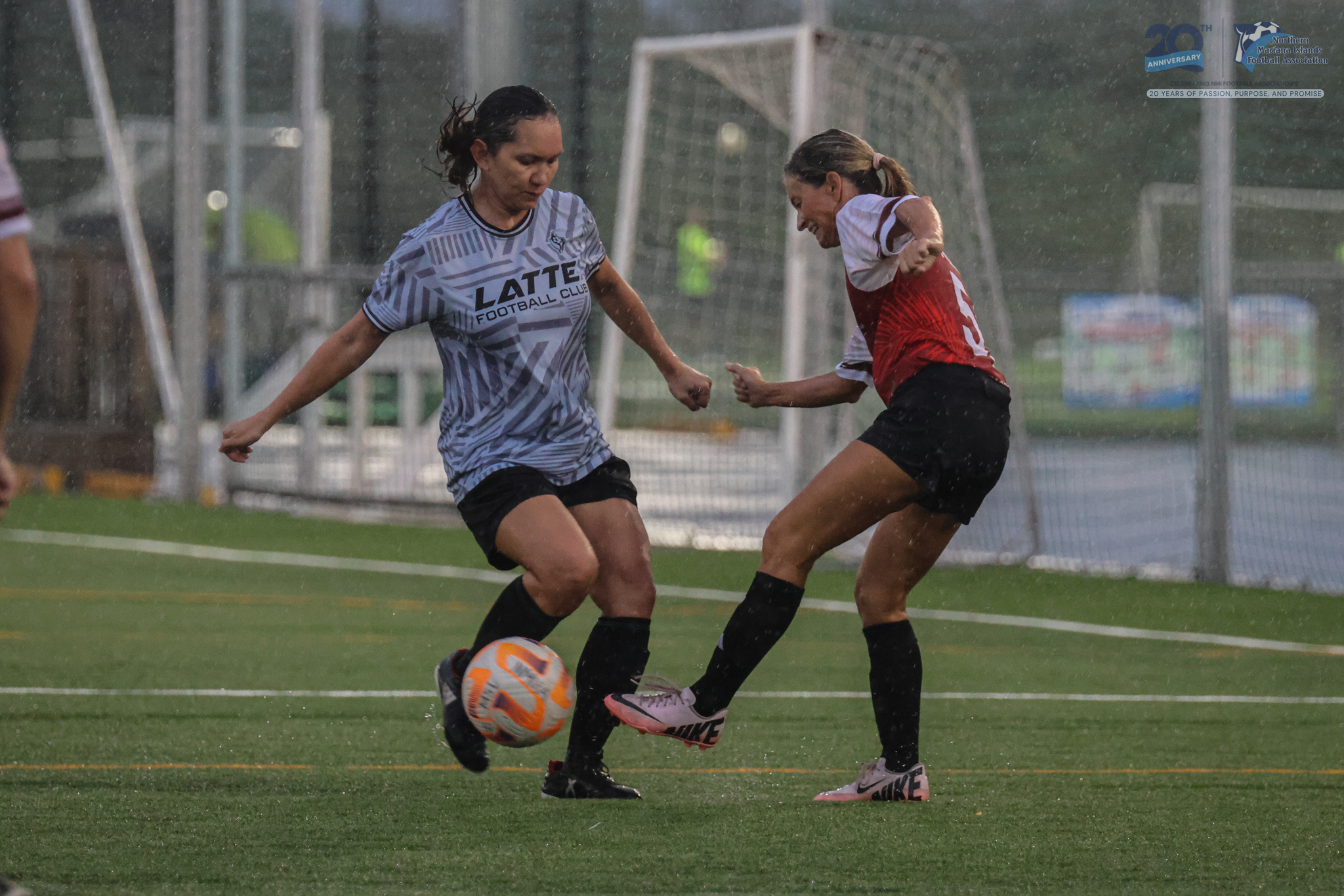 May be an image of 2 people, people playing football, people playing soccer and text
