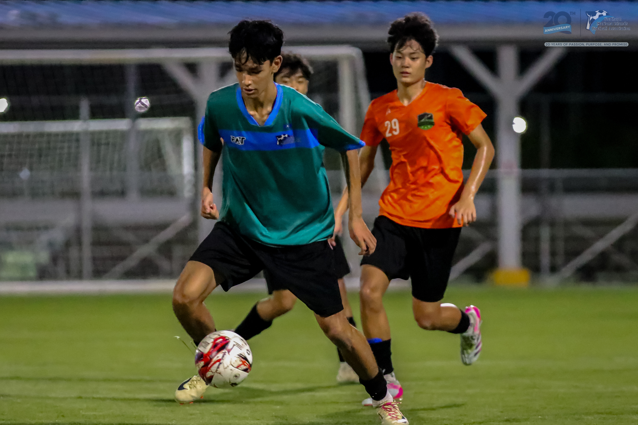 May be an image of 2 people, people playing football, people playing soccer and text