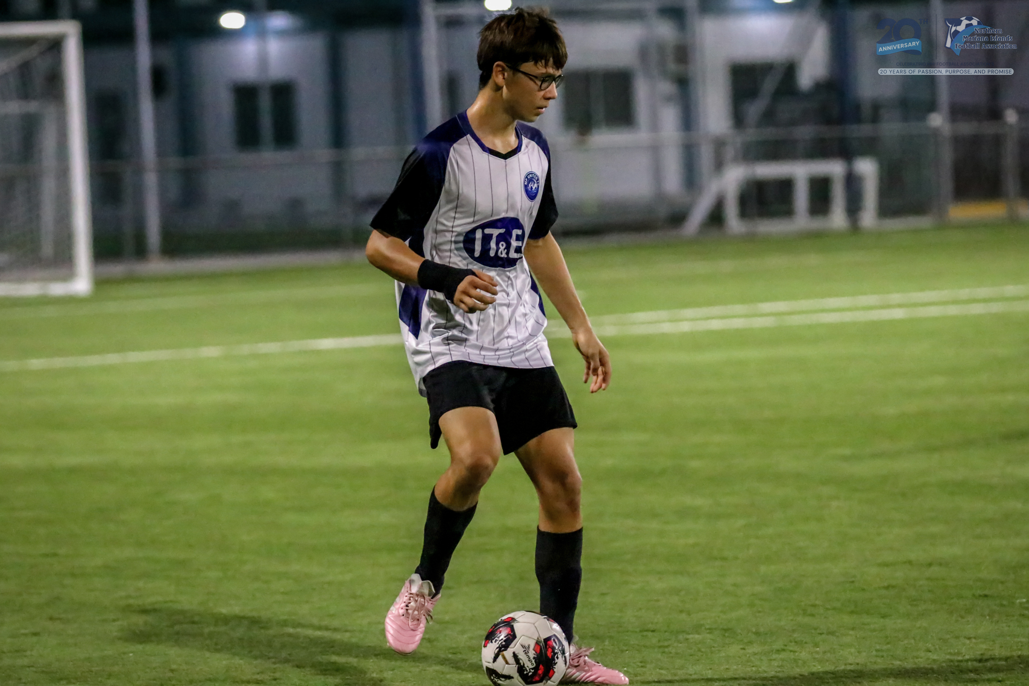 May be an image of 1 person, playing soccer, playing football and text