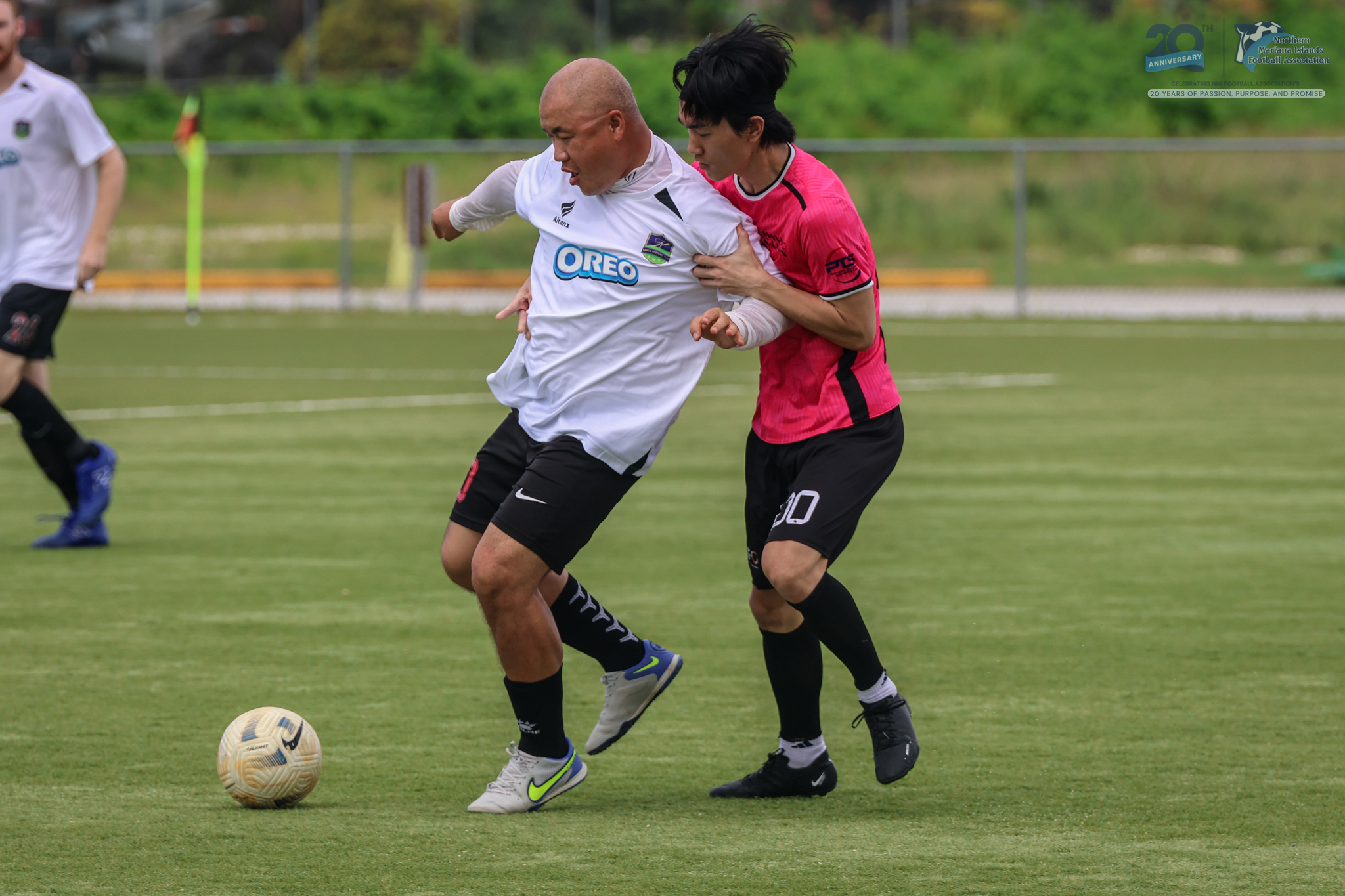 May be an image of 3 people, people playing football, people playing soccer and text