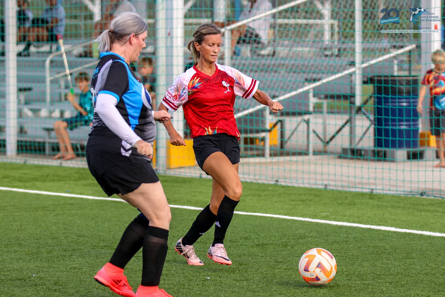 May be an image of football, soccer, grass and text