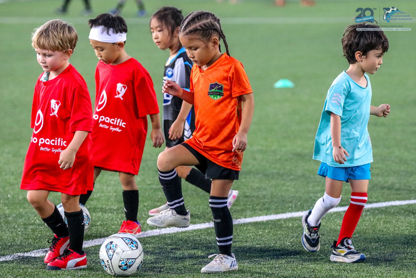 May be an image of child, soccer, football and text