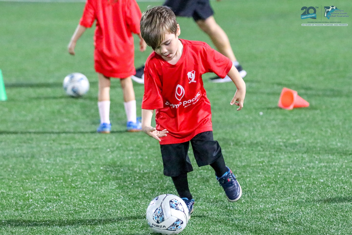 May be an image of child, soccer, football and text