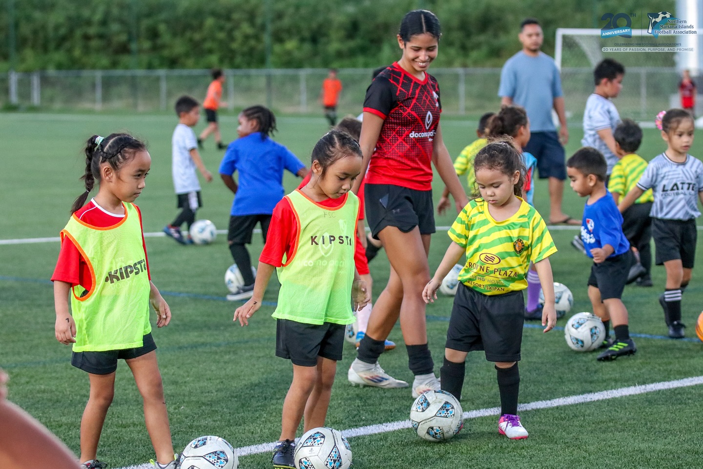 May be an image of child, football, soccer and text