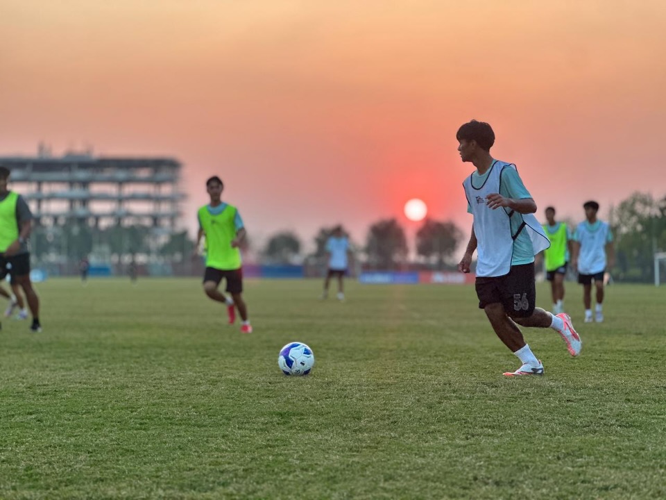 May be an image of football, soccer, grass and text